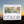 Load image into Gallery viewer, our artist reserve 10oz white whole bean coffee bag with illustrated label and COLOR logo at the bottom with a sunset background