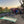 Load image into Gallery viewer, raised whole bean coffee drying beds with a clothes line in the back and a little house in Mexico