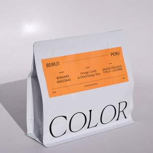 Color coffee white 10oz whole bean coffee bag with COLOR logo and orange rectangular label