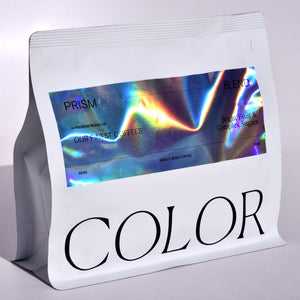 new prism coffee in our new 10oz white whole bean coffee bags with reflective shimmery label