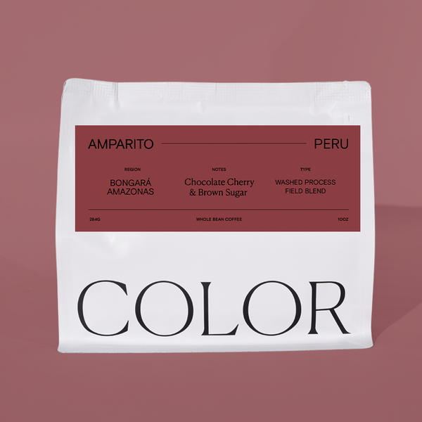 10 oz white whole bean coffee bag with burgundy label and COLOR logo at the bottom on a light burgundy background