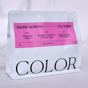 our 10oz white whole bean coffee bag with pink label and COLOR logo