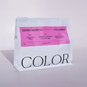 our 10oz white whole bean coffee bag with pink label and COLOR logo