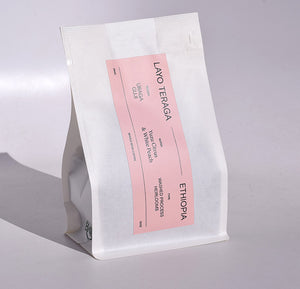 new ethiopia layo whole bean coffee in our white 10oz bag with pink label