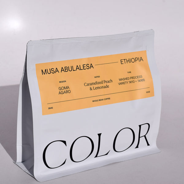 color coffee white 10oz whole bean coffee bag with orange rectangle label and COLOR logo