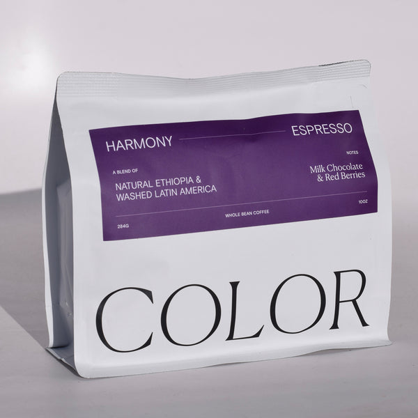 Color Coffee white 10oz whole bean coffee bag with purple label for Harmony Espresso