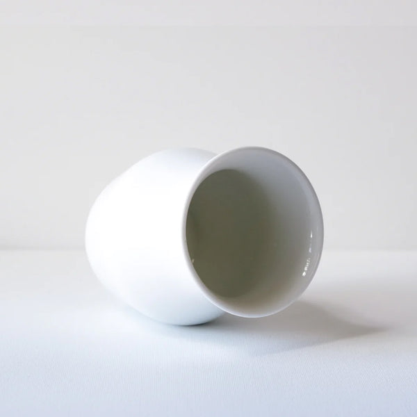 Origami white mug with no handle on its side