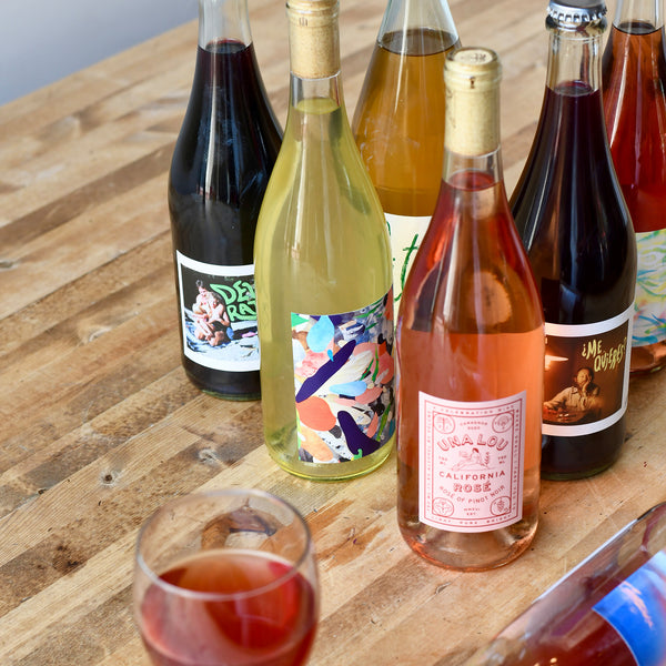 bottles of wine on a wood table