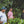 Load image into Gallery viewer, Three men standing among coffee trees in a coffee farm
