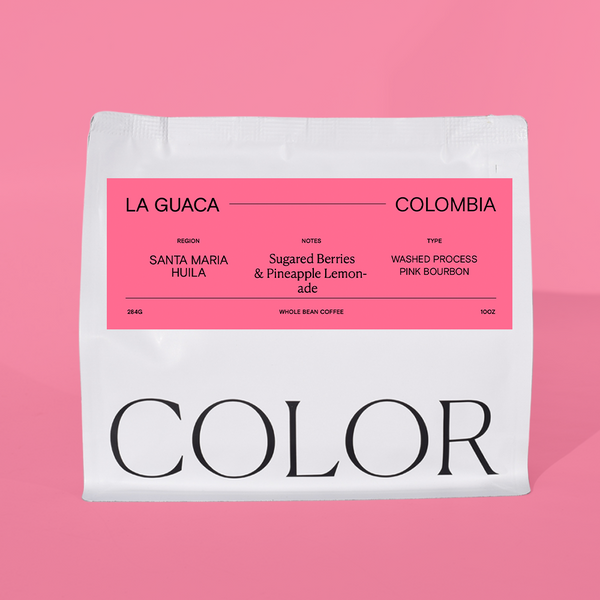 our 10oz white whole bean coffee bag with pink label and COLOR logo at the bottom on a pink label