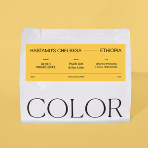 A white bag of coffee with a large yellow label reading 'HABTAMU'S CHELBESA ETHIOPIA' and 'COLOR' in large black letters at the bottom, photographed against a solid pale yellow background.