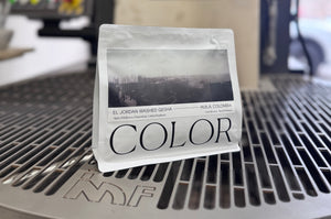 a 10oz bag of Color coffee sitting on our state of the art roaster