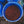 Load image into Gallery viewer, A top-down view of a blue plastic barrel filled with small red berries, surrounded by other blue barrels on a dark ground.
