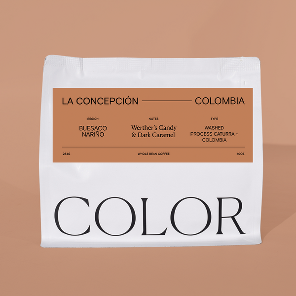 our 10oz white whole bean coffee bag with brown label and COLOR logo at the bottom on a brown background