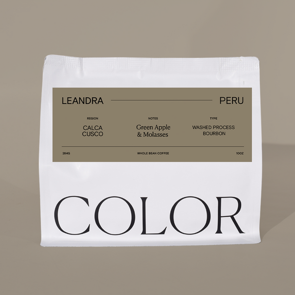 our 10oz white whole bean coffee bag with brown label on a brown background