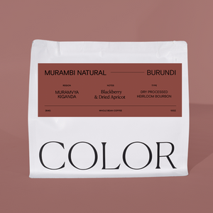 our white 10oz whole bean coffee bag with brown label and COLOR logo at the bottom on a brown background.
