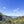 Load image into Gallery viewer, Scenic view of a mountainous landscape with green trees and a clear blue sky - Ecuador Loja
