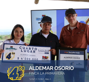 Three people holding awards with text and logos on a screen in the background