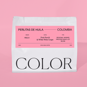 our 10oz white whole bean coffee bag with pink label on a pink background