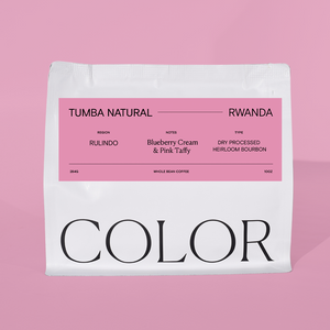 our 10o whole bean white coffee bag with pink label and COLOR logo at the bottom on a pink background