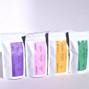 four of our roaster choice single origins in our white 4oz bag